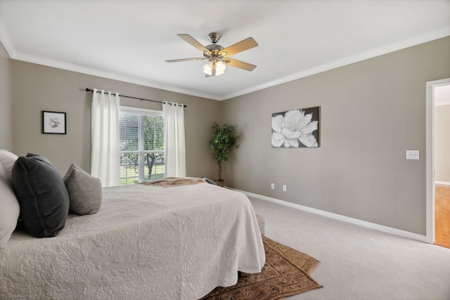 bedroom featuring ceiling fan, carpet, and ornamental molding