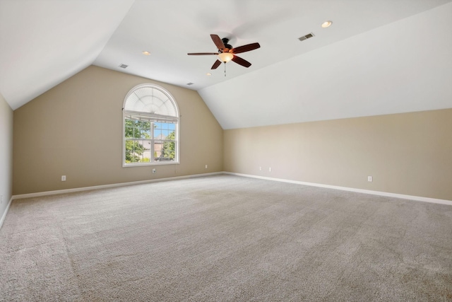 bonus room with ceiling fan, light colored carpet, and lofted ceiling