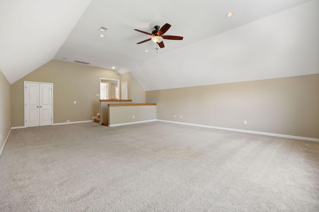 bonus room featuring carpet floors, vaulted ceiling, and ceiling fan