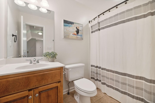 bathroom with toilet, tile patterned floors, and vanity