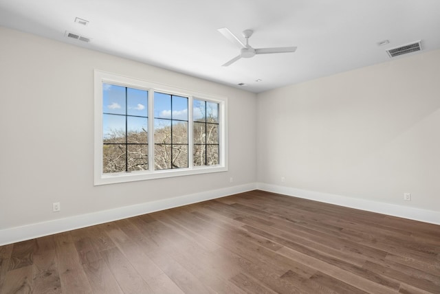 unfurnished room with hardwood / wood-style flooring and ceiling fan