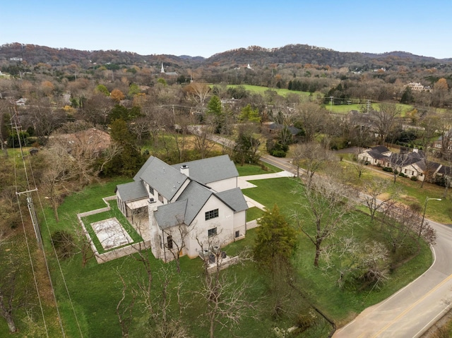 birds eye view of property with a mountain view