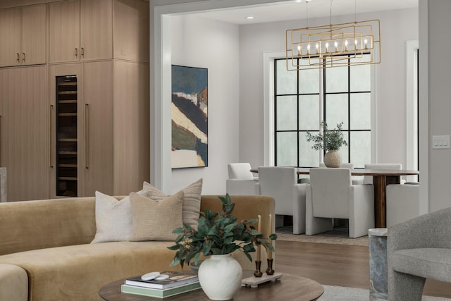 living room with wood-type flooring and a chandelier