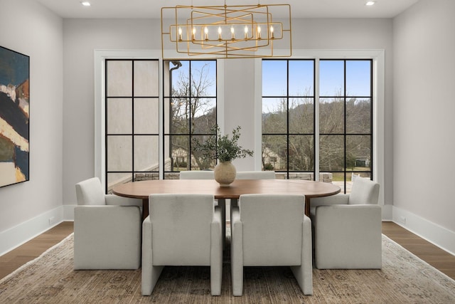 dining space featuring wood-type flooring