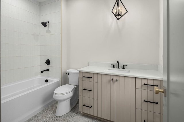 full bathroom with vanity, tiled shower / bath combo, and toilet