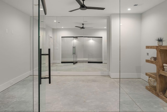 bathroom with concrete floors and ceiling fan