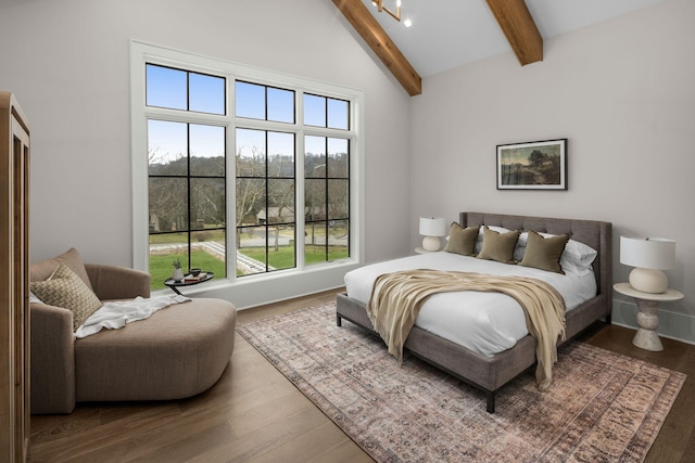 bedroom featuring hardwood / wood-style floors, beam ceiling, and high vaulted ceiling