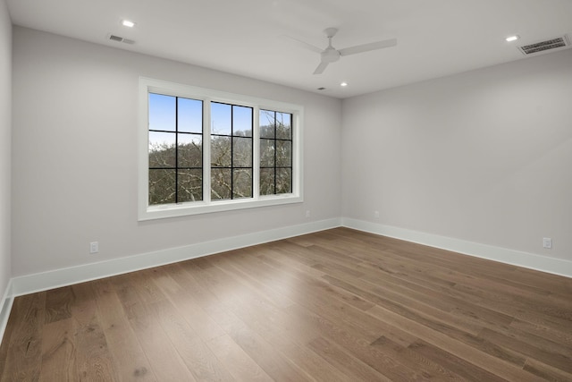 unfurnished room featuring ceiling fan and wood-type flooring