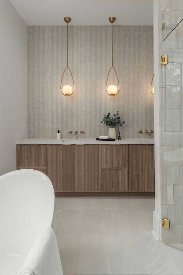 bathroom featuring tile patterned flooring, vanity, and separate shower and tub