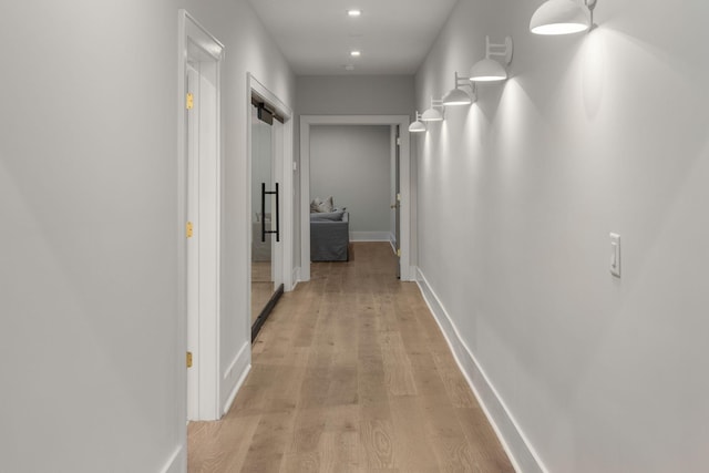 hall with light hardwood / wood-style floors