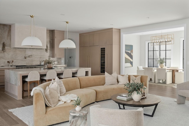 living room with hardwood / wood-style flooring and a chandelier