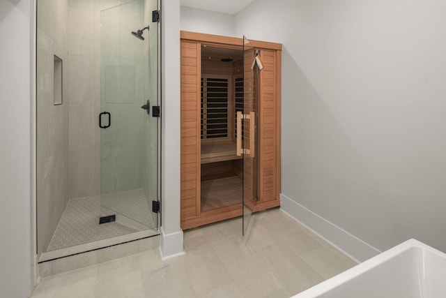 bathroom featuring an enclosed shower