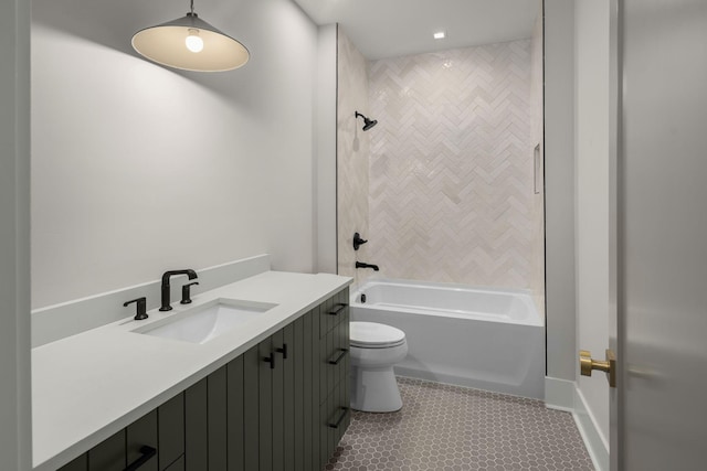 full bathroom with tiled shower / bath combo, vanity, and toilet