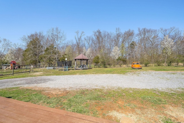 view of yard with a gazebo and fence