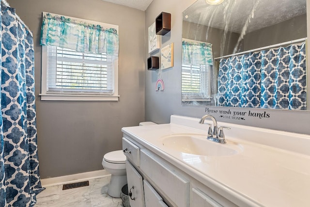 bathroom with visible vents, toilet, marble finish floor, a textured ceiling, and baseboards