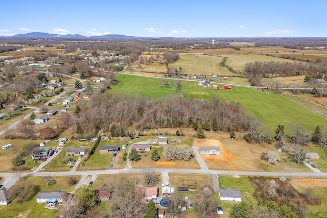 birds eye view of property featuring a mountain view and a rural view