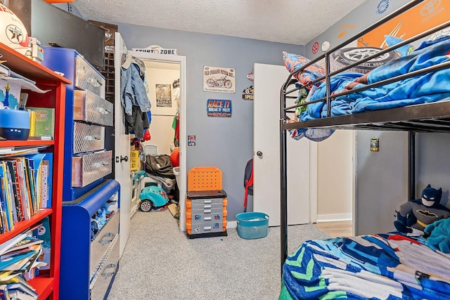 carpeted bedroom with a textured ceiling