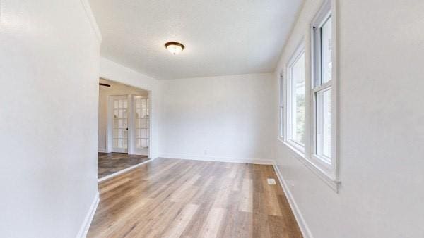 unfurnished room with light hardwood / wood-style flooring