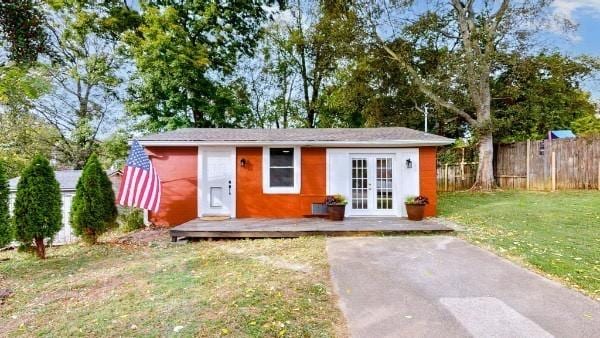 view of outbuilding with a yard