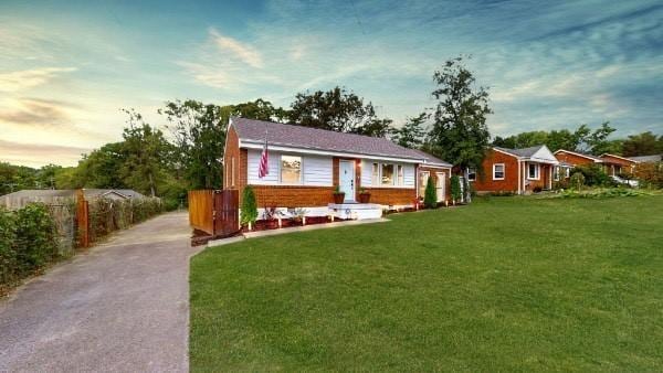 view of front of house with a lawn