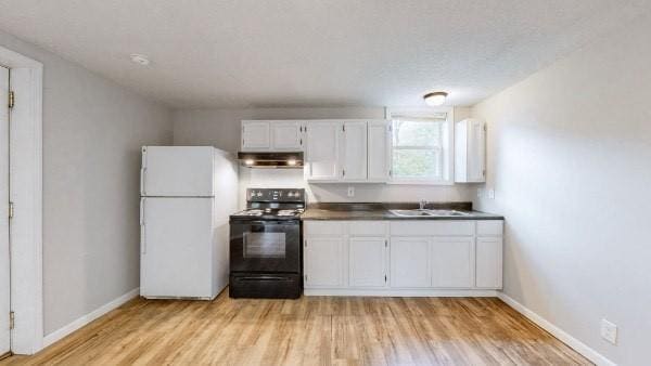 kitchen featuring white cabinetry, sink, light hardwood / wood-style flooring, white refrigerator, and black electric range