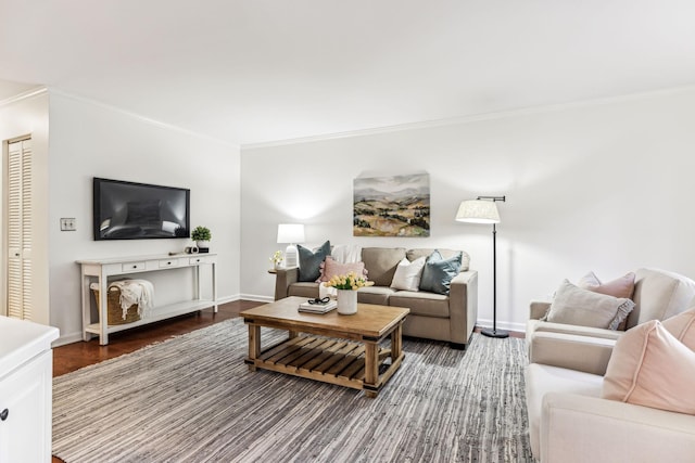 living room with crown molding and hardwood / wood-style floors