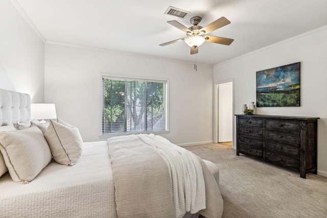 bedroom featuring crown molding, light colored carpet, and ceiling fan