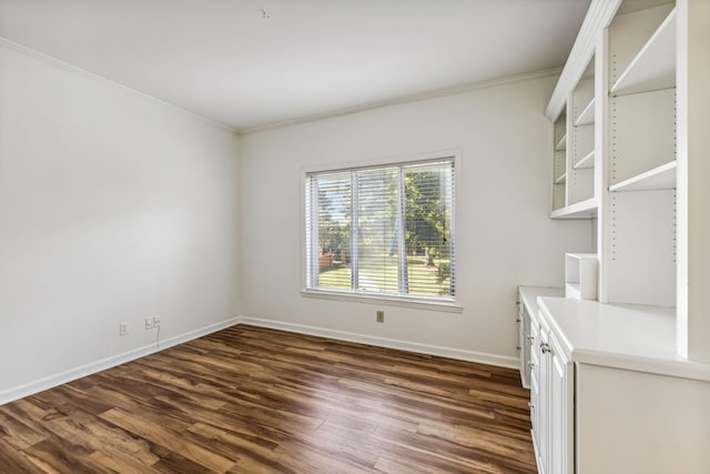 interior space with dark hardwood / wood-style flooring and crown molding