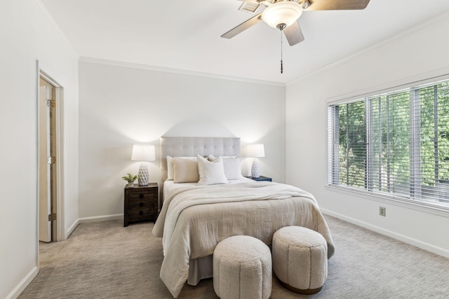 bedroom with ceiling fan, ornamental molding, and light carpet