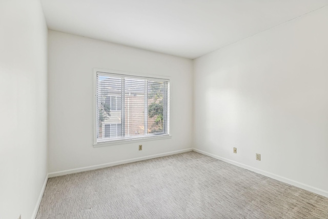 empty room featuring carpet flooring