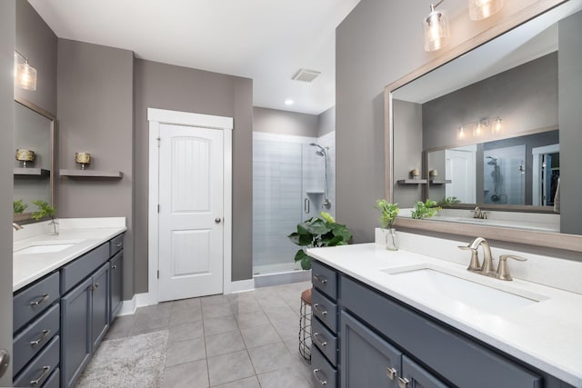 bathroom featuring walk in shower, tile patterned floors, and vanity