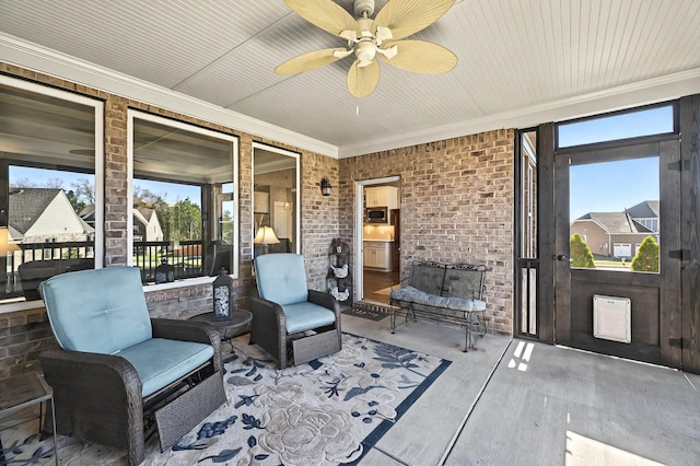 sunroom / solarium with ceiling fan