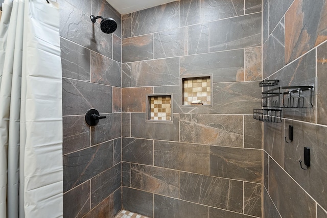 bathroom featuring curtained shower