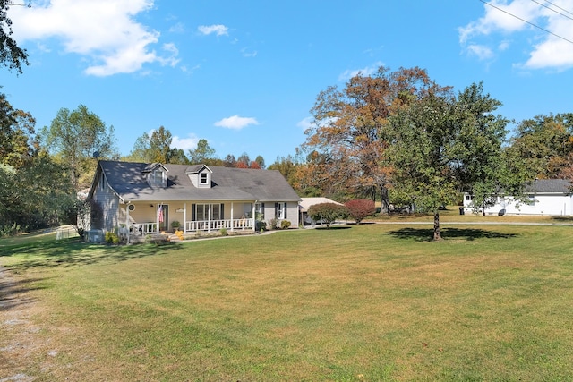 view of front of house featuring covered porch and a front yard