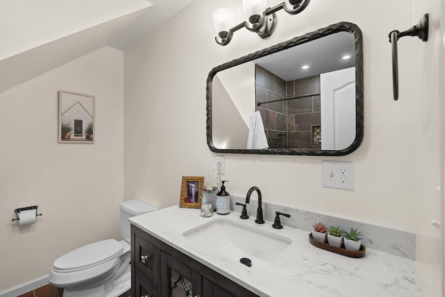 bathroom featuring toilet, vanity, and a shower with shower curtain