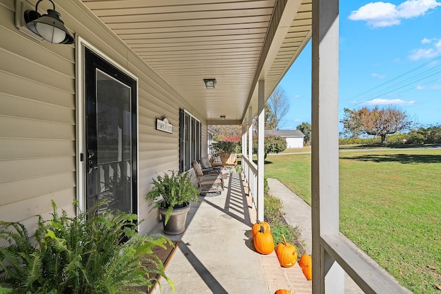 view of patio featuring a porch