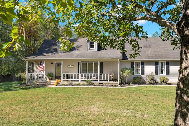 view of front of property with covered porch and a front yard