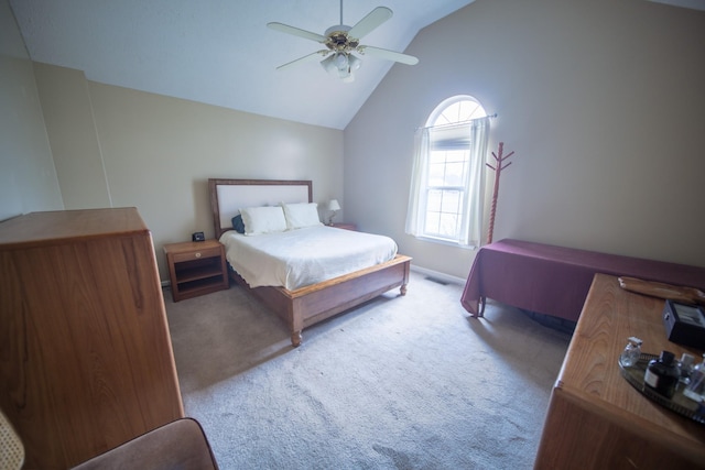 bedroom with lofted ceiling, light carpet, and ceiling fan