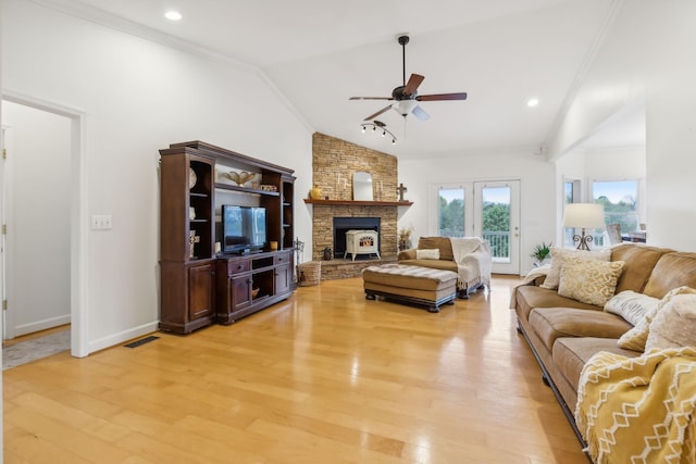 living room with ceiling fan, crown molding, light hardwood / wood-style flooring, and lofted ceiling