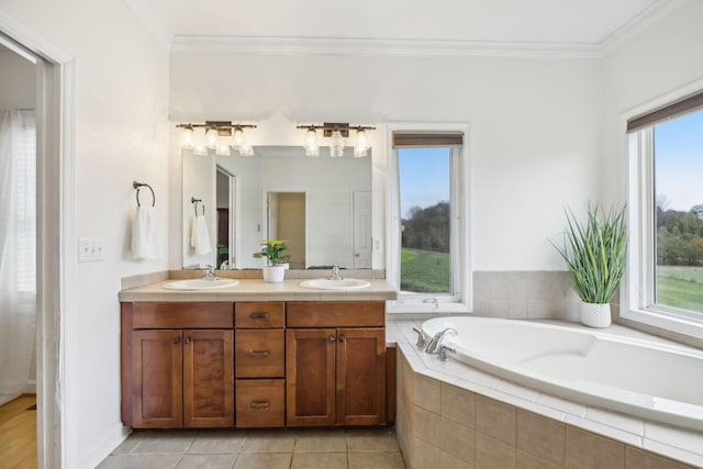 bathroom with ornamental molding, tile patterned floors, a relaxing tiled tub, and vanity