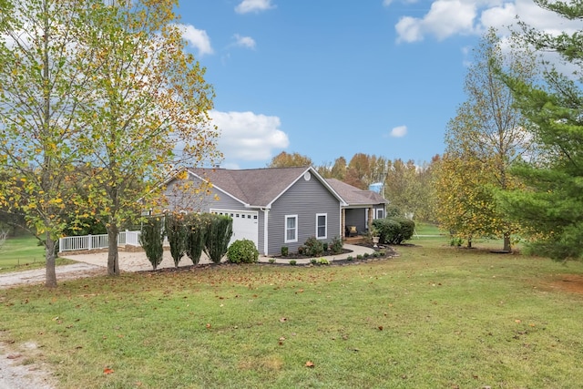 view of side of home featuring a yard and a garage