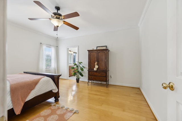 bedroom with ceiling fan, light hardwood / wood-style flooring, and crown molding