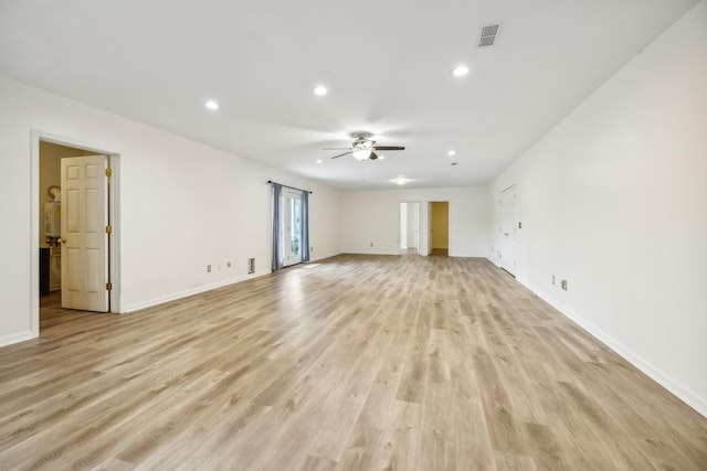 unfurnished living room featuring ceiling fan and light hardwood / wood-style flooring