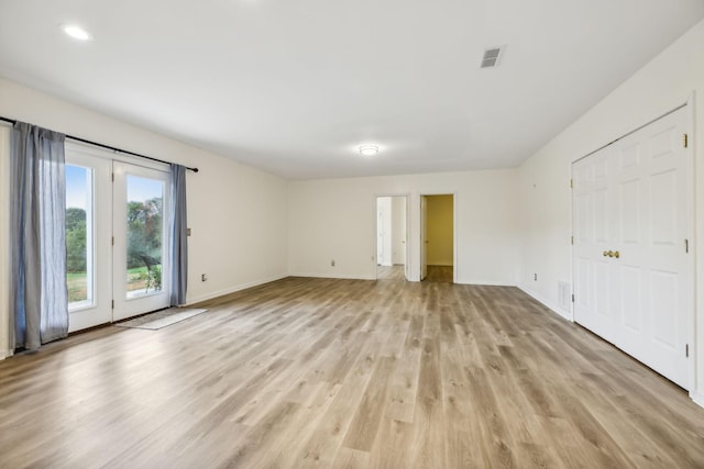 empty room with light wood-type flooring