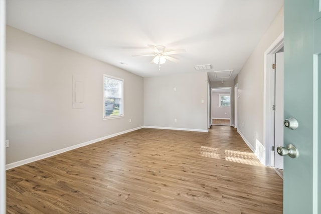 spare room featuring ceiling fan and light wood-type flooring