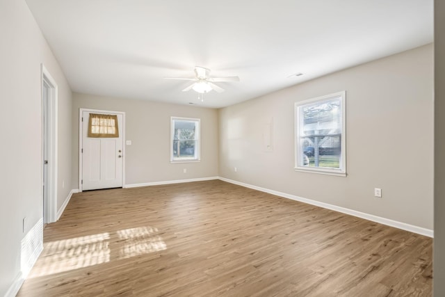 spare room featuring ceiling fan and light hardwood / wood-style floors