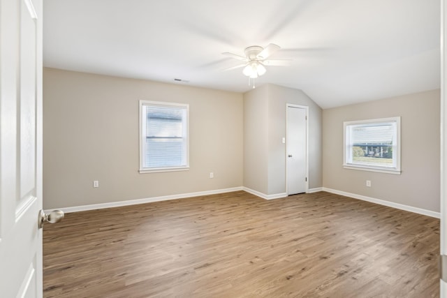 interior space with lofted ceiling, light hardwood / wood-style floors, and ceiling fan