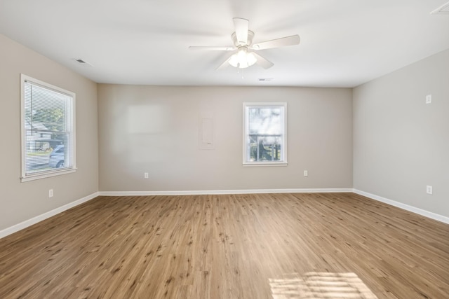 unfurnished room featuring ceiling fan and light wood-type flooring