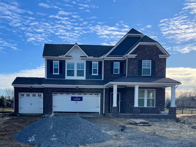 view of front of house with a garage and covered porch