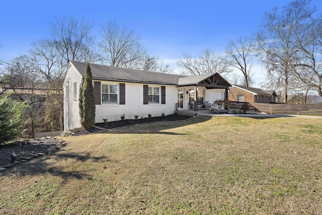 ranch-style home with a front lawn